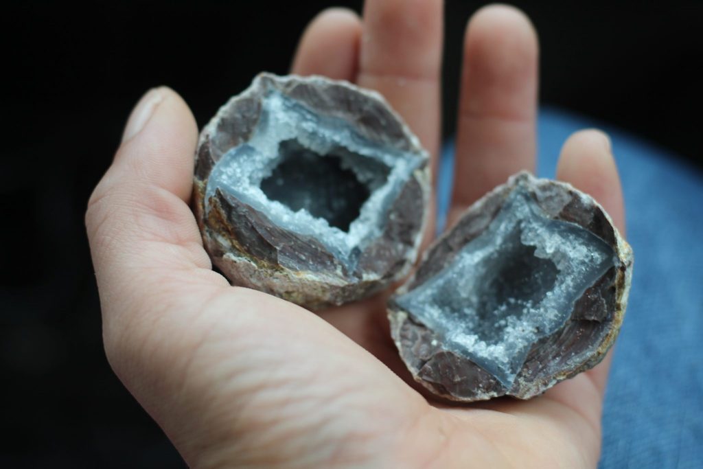 Hand holding a cracked Dugway Geode